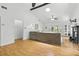 Spacious living room with high ceilings, wood floors, and a cozy seating arrangement at 563 Belltower Ave # 240, Deltona, FL 32725