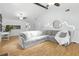 Spacious living room with a large sectional couch and wood floors at 563 Belltower Ave # 240, Deltona, FL 32725