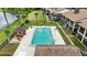 Aerial view of the community pool with lots of lounge seating at 563 Belltower Ave # 240, Deltona, FL 32725
