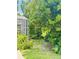 Private backyard features lush greenery and a screened in patio at 660 Neile Ct, Oviedo, FL 32765