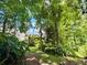 Secluded backyard oasis, enveloped by mature trees for ultimate privacy at 660 Neile Ct, Oviedo, FL 32765