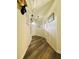 Inviting entryway with new wood-look floors, wainscoting, and neutral paint at 660 Neile Ct, Oviedo, FL 32765
