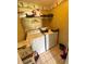 Cozy laundry room features white appliances, a shelf, and tile flooring at 660 Neile Ct, Oviedo, FL 32765
