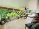 Relaxing screened porch with comfortable seating and views of the lush backyard at 660 Neile Ct, Oviedo, FL 32765