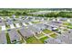 An aerial view of the property features an appealing backyard and solar panels at 7112 Mottled Duck Dr, Harmony, FL 34773