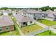 Birds eye view of a home with a fenced yard, patio, and landscaped surroundings within a residential neighborhood at 7112 Mottled Duck Dr, Harmony, FL 34773