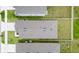 Overhead view of a residential property highlighting its roof, fenced backyard, and adjacent homes at 7112 Mottled Duck Dr, Harmony, FL 34773