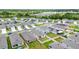 An aerial view of the property features an appealing backyard and solar panels at 7112 Mottled Duck Dr, Harmony, FL 34773