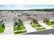 This is an aerial view of a well-maintained neighborhood with lush trees at 7112 Mottled Duck Dr, Harmony, FL 34773