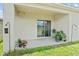 Covered back patio with sliding glass doors and potted plants, creating a relaxing outdoor space at 7112 Mottled Duck Dr, Harmony, FL 34773