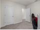Bedroom featuring neutral walls, grey carpet, closet and computer chair at 7112 Mottled Duck Dr, Harmony, FL 34773