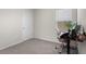 Bedroom with neutral colored walls, carpeted floor, and a desk with a view at 7112 Mottled Duck Dr, Harmony, FL 34773