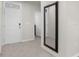 Bright entryway with tile floors, front door, and a large mirror at 7112 Mottled Duck Dr, Harmony, FL 34773