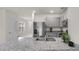 Modern kitchen featuring stainless steel appliances, granite countertops, and ample cabinet space at 7112 Mottled Duck Dr, Harmony, FL 34773