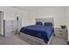 Comfortable bedroom with matching bedside tables and access to an ensuite bathroom with standing shower at 7112 Mottled Duck Dr, Harmony, FL 34773