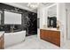 Luxurious bathroom featuring freestanding tub, modern vanity, and stylish tile at 7733 Pointe Venezia Dr, Orlando, FL 32836