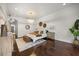 Cozy bedroom showcasing hardwood floors, chandelier, and stylish furnishings at 7733 Pointe Venezia Dr, Orlando, FL 32836