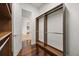 Well-organized walk-in closet with custom shelving, wood floors, and ample storage, offering style and functionality at 7733 Pointe Venezia Dr, Orlando, FL 32836
