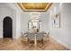 Formal dining room featuring elegant lighting, herringbone floors, and sophisticated decor at 7733 Pointe Venezia Dr, Orlando, FL 32836