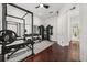 Bright exercise room includes modern equipment, mirrored walls, and luxury finishes at 7733 Pointe Venezia Dr, Orlando, FL 32836