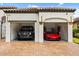 Attached two-car garage featuring an exotic sports car and a luxury SUV at 7733 Pointe Venezia Dr, Orlando, FL 32836