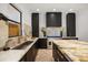 Kitchen featuring stone counters and backsplash, stainless steel appliances, and modern cabinets at 7733 Pointe Venezia Dr, Orlando, FL 32836