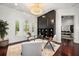 Bright office features modern decor, a built-in bookcase, and three large windows at 7733 Pointe Venezia Dr, Orlando, FL 32836