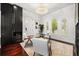 Bright office features a glass desk, modern lighting, sleek built-ins, and plenty of natural light at 7733 Pointe Venezia Dr, Orlando, FL 32836