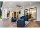 Covered patio featuring a fireplace, sauna, and comfortable seating area at 7733 Pointe Venezia Dr, Orlando, FL 32836