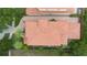 Aerial view of a tile roof and lush landscaping surrounding the house at 800 Hamilton Place Ct, Winter Park, FL 32789