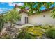 Beautiful backyard featuring a tranquil pond, stone patio, and lush landscaping at 800 Hamilton Place Ct, Winter Park, FL 32789