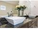 Bathroom vanity with double sinks, modern faucets, dark cabinets, and granite counters at 800 Hamilton Place Ct, Winter Park, FL 32789