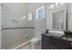 Bright bathroom features tile floors, a glass shower, and a modern vanity at 800 Hamilton Place Ct, Winter Park, FL 32789