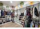 Spacious walk-in closet with custom shelving and ample storage for shoes and clothing at 800 Hamilton Place Ct, Winter Park, FL 32789