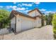 Spacious home with a large garage, brick driveway, and tidy landscaping at 800 Hamilton Place Ct, Winter Park, FL 32789