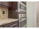 Built-in stainless steel appliances include oven, microwave, and cooktop at 800 Hamilton Place Ct, Winter Park, FL 32789