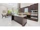 Spacious eat-in kitchen features island with cooktop, stainless appliances and dining table at 800 Hamilton Place Ct, Winter Park, FL 32789