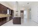 Open kitchen features stainless steel appliances, granite counters and island at 800 Hamilton Place Ct, Winter Park, FL 32789