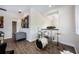 Open-concept living room featuring hardwood floors, neutral paint, and a complete drumset at 800 Hamilton Place Ct, Winter Park, FL 32789
