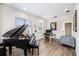Home office features a piano, desk, and comfortable seating, perfect for work or hobbies at 800 Hamilton Place Ct, Winter Park, FL 32789