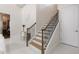 Elegant staircase with wood and iron details leads to the upper level at 800 Hamilton Place Ct, Winter Park, FL 32789