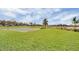 Community basketball court with lush green grass, ideal for outdoor recreational activities at 8113 Key West Dove St, Winter Garden, FL 34787