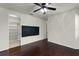 Bedroom with a walk in closet and dark wood floors and ceiling fan at 8113 Key West Dove St, Winter Garden, FL 34787