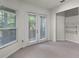 Bedroom featuring carpet, a window with blinds, and french doors to a balcony at 8113 Key West Dove St, Winter Garden, FL 34787