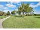 Serene community park featuring lush lawns, mature trees, and winding walking paths at 8113 Key West Dove St, Winter Garden, FL 34787