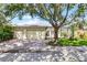 Home exterior featuring a three-car garage, screened in lanai, and well-maintained landscaping at 8113 Key West Dove St, Winter Garden, FL 34787