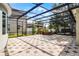 Spacious screened-in lanai with tiled floor, offering an inviting outdoor living space at 8113 Key West Dove St, Winter Garden, FL 34787