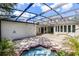 Large, screened-in lanai features a spa and ample space for outdoor entertaining at 8113 Key West Dove St, Winter Garden, FL 34787