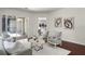 Comfortable living room with neutral tones, wood floors, and sliding doors to outdoor space at 8113 Key West Dove St, Winter Garden, FL 34787