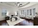 Relaxing main bedroom with hardwood floors, tray ceiling, and an abundance of natural light at 8113 Key West Dove St, Winter Garden, FL 34787